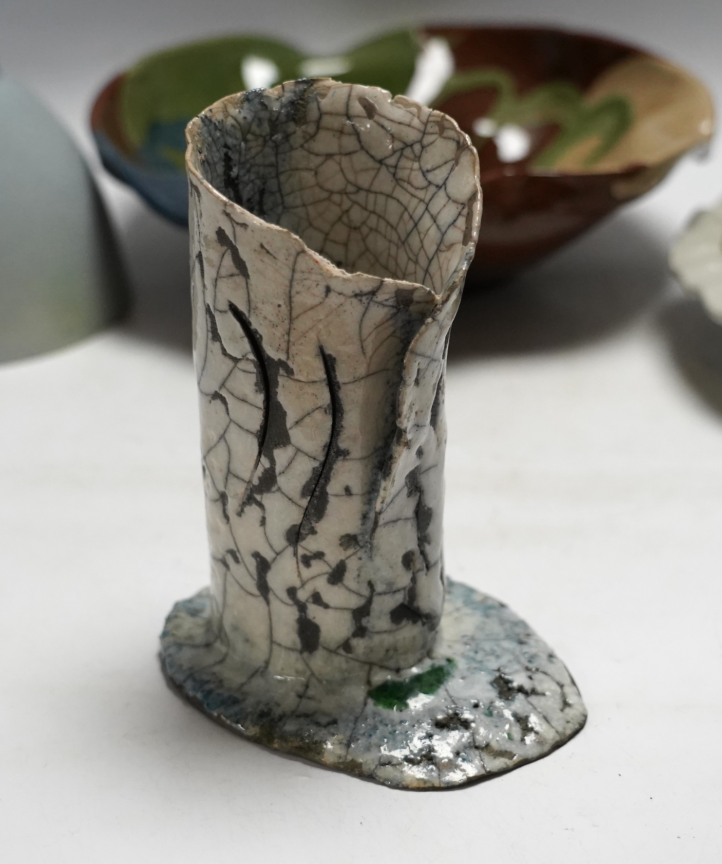 A Raku ware pottery vase, a Leiard dish, a dish and a grey glazed vase, Raku vase 17.5cm high